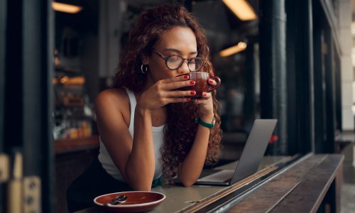 coffee-shop-laptop-and-black-woman-with-remote-work-for-copywriting-website-marketing-or-working.jpg