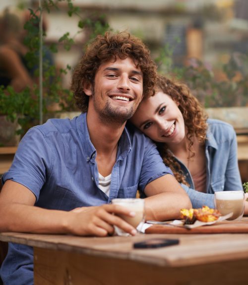 young-people-enjoying-a-beverage-at-a-sidewalk-cafe.jpg